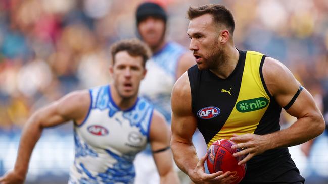 MELBOURNE, AUSTRALIA - MAY 18: Noah Balta of the Tigers runs with the ball during the round ten AFL match between Richmond Tigers and North Melbourne Kangaroos at Melbourne Cricket Ground, on May 18, 2025, in Melbourne, Australia. (Photo by Morgan Hancock/Getty Images)