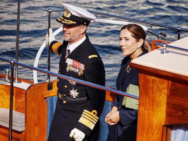 Denmark's royal couple, King Frederik and Queen Mary, officially disembark from the Dannebrog royal ship in Copenhagen. Picture: AFP