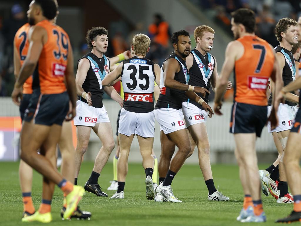 Power players celebrate a goal with Willie Rioli.