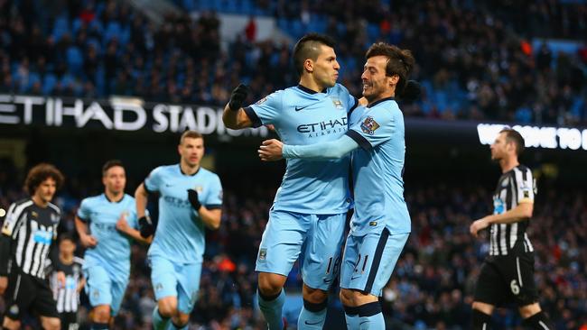 Sergio Aguero of Manchester City celebrates a penalty with David Silva.