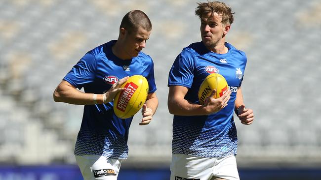 Bailey Scott, left, with team-mate Trent Dumon before his AFL debut against the Dockers