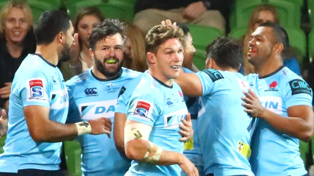 Adam Ashley-Cooper of the Waratahs is congratulated by his teammates.