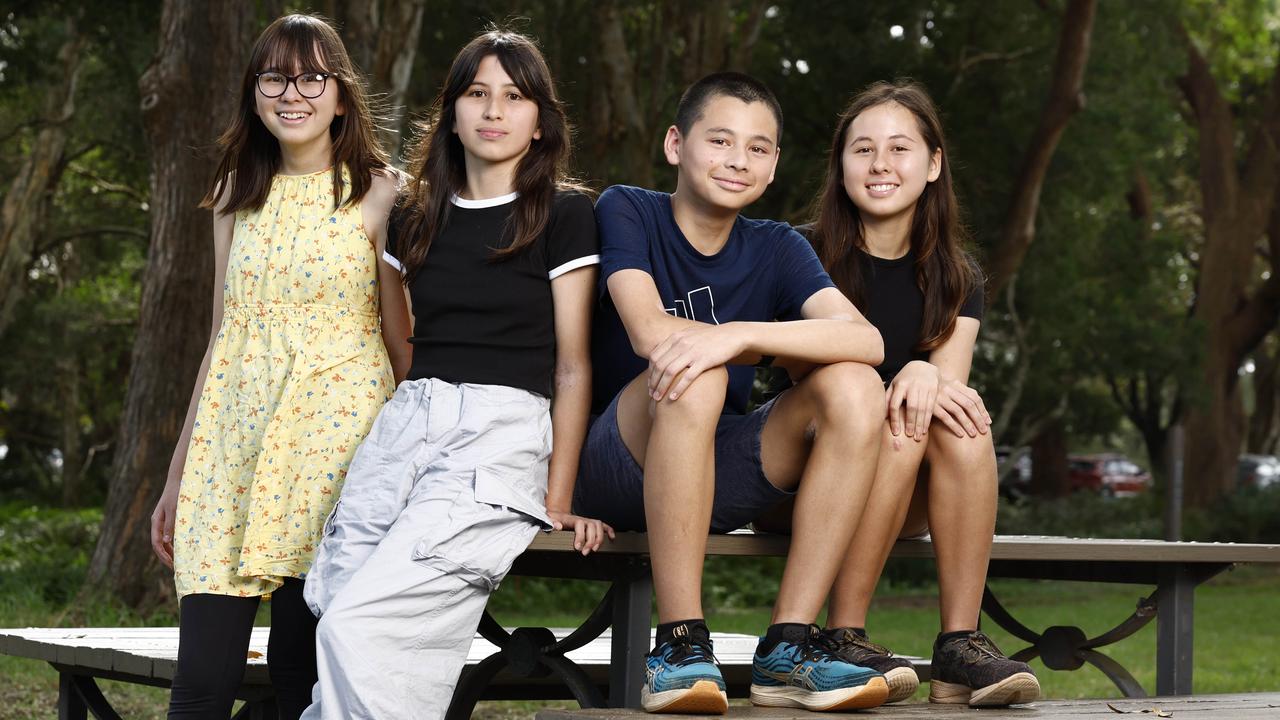 Research shows that social media is impacting children's ability to learn in the classroom, reducing their focus and attention as calls grow for a national blanket ban. Pictured at Centennial Park in Sydney are Abbey Sheary, 13, Anna Sheary, 14, Luke Goodall, 15, and Lana Goodall, 16. Picture: Richard Dobson