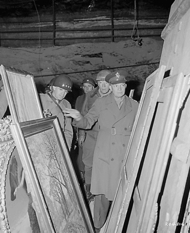 An undated photo of Supreme Commander of Allied Forces in Europe General Dwight Eisenhower looks at artworks stolen by the Nazis during World War II.