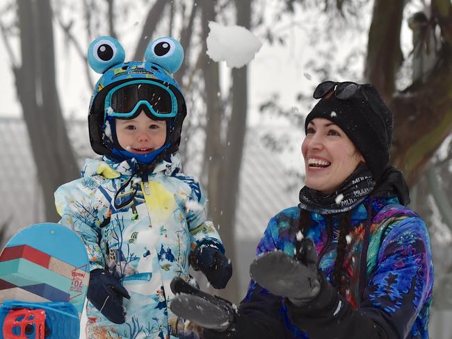 Snow delight Ollie Howard 2, with mum Andge play in the snow at Falls Creek today after the resort opened again for business. Falls Creek & Mt Hotham both have snow depth around 130cm after huge snowfalls during the lockdown.Picture: Chris Hocking