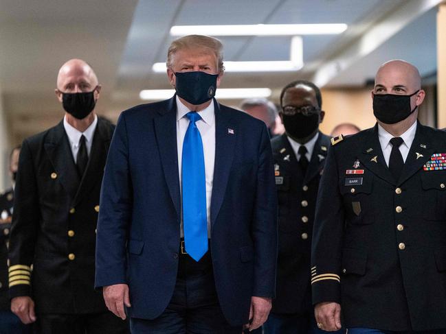 US President Donald Trump wears a mask as he visits Walter Reed National Military Medical Center in Maryland. (Photo: AFP)