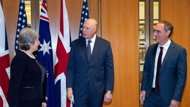 British High Commissioner Victoria Treadell (L), Australia's Minister for Defence Peter Dutton (C) and US Charge d’Affaires Michael Goldman (R) after signing the Exchange of Naval Nuclear Propulsion Information Agreement at Parliament House in Canberra.