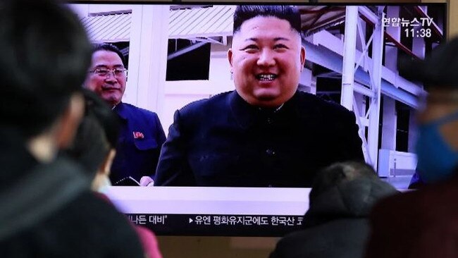 North Koreans watch Kim Jong-un on TV. Picture: Getty Images