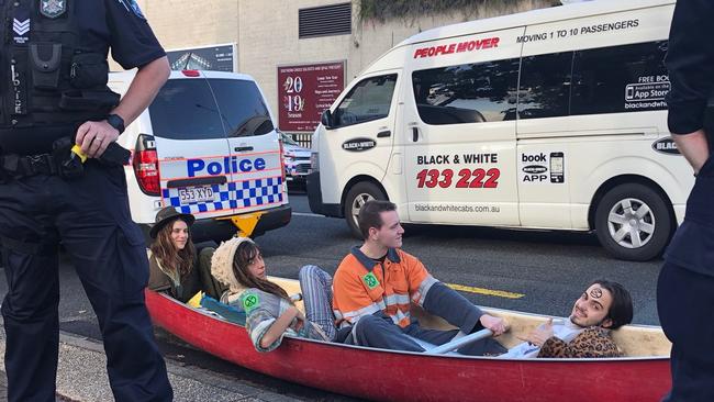 Four activists locked themselves onto the canoe using metal pipes, meaning they were be unable to be removed without being cut out. Picture: Andrea Macleod