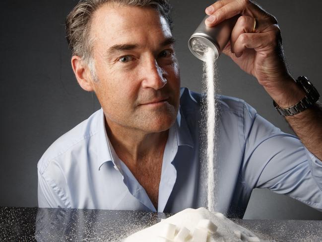 Former Australian of the Year, ophthalmologist James Muecke, with sugar, which he says is ruining children’s health. Picture Matt Turner.