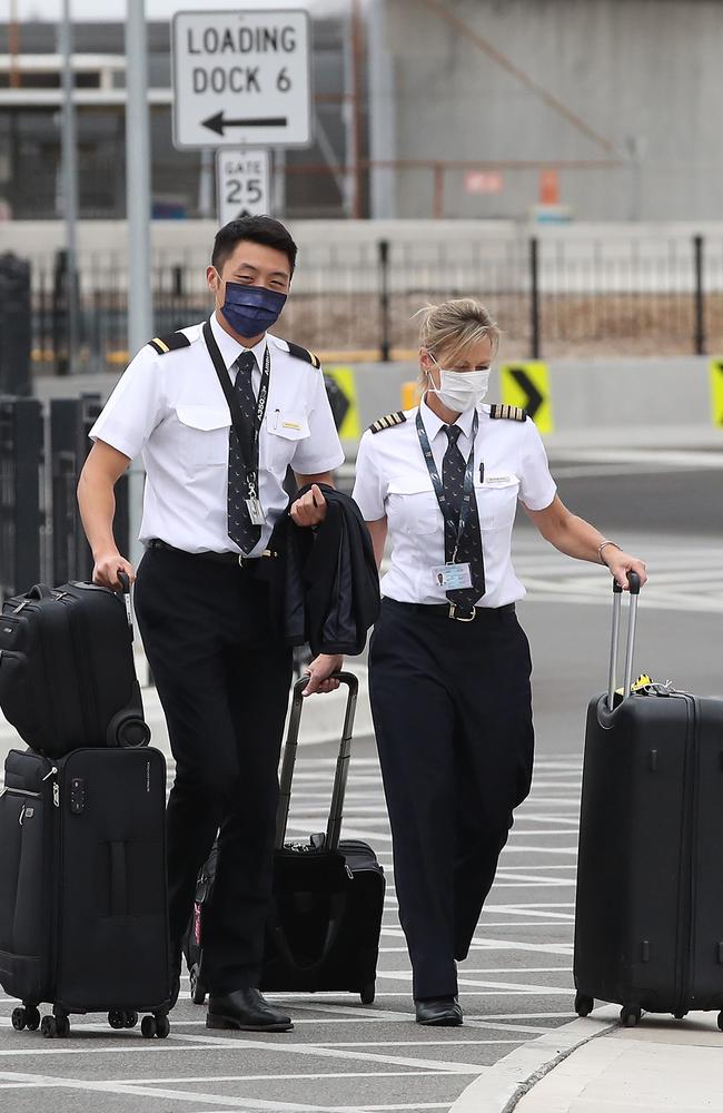 Aircrews at Sydney Airport on Saturday were collected by ground transport and taken to their hotels. Picture: David Swift