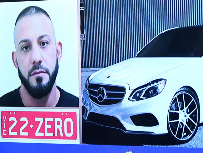 An image of Ricardo Barbaro is displayed on a television during a press conference in Melbourne, Thursday, May 7, 2020. The Homicide squad is appealing for Ricardo Barbaro to hand himself into police for questioning following the death of a woman in South Melbourne. (AAP Image/James Ross) NO ARCHIVING