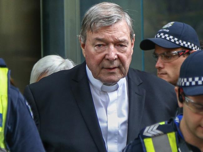 FILE - In this May 2, 2018, file photo, Cardinal George Pell, the most senior Catholic cleric to face sex charges, leaves court in Melbourne, Australia. Pell was sentenced in an Australian court on Wednesday, March 13, 2019 to 6 years in prison for molesting two choirboys in a Melbourne cathedral more than 20 years ago.  (AP Photo/Asanka Brendon Ratnayake, File)