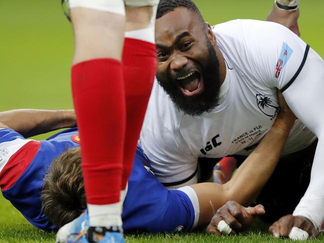 FILE - In this Nov. 24, 2018, file photo, Fiji's Semi Radradra celebrates after scoring a try against France during a rugby international between France and Fiji at Stade de France in Paris. Teams from the Pacific islands are immensely popular around the world and their appearances at the Rugby World Cup are likely to attract large and admiring crowds. But an appreciative welcome won't disguise the fact that the Pacific nations begin the tournament under a considerable handicap. (AP Photo/Christophe Ena, File)