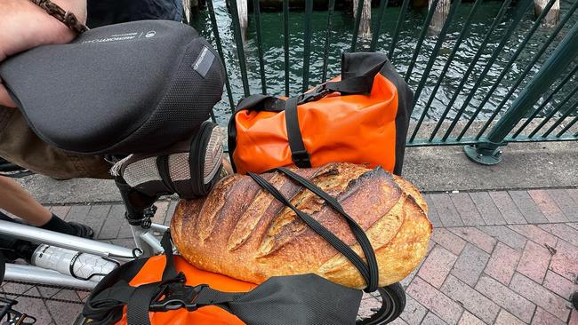 Mr Dight and Mr Schoorl are riding with a loaf of homemade sourdough bread.