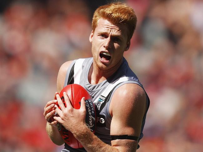 Willem Drew of the Power marks the ball during the Round 1 AFL match between the Melbourne Demons and the Port Adelaide Power at the MCG in Melbourne, Saturday, March 23, 2019. (AAP Image/Daniel Pockett) NO ARCHIVING, EDITORIAL USE ONLY