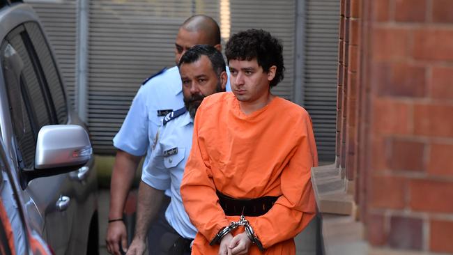 Mert Ney is escorted from a Corrective Services transport vehicle at the NSW Supreme Court in Sydney in May. Picture: Joel Carrett