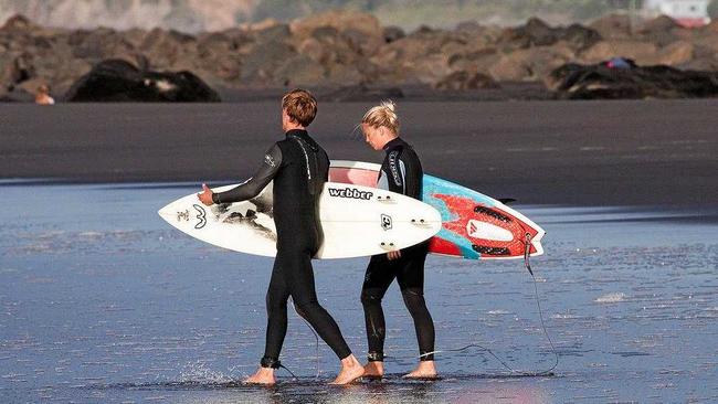 SUIT UP: Locals don wetsuits while southern visitors are still surfing in in boardshorts. Picture: Supplied