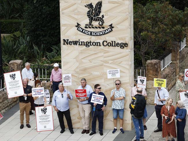 DAILY TELEGRAPH 31ST JANUARY 2024Pictured in Stanmore outside Newington College as boys arrive for their first day of the new school year, are parents with placards during a silent protest against the proposed switch to Newington College becoming a co-ed school.Picture: Richard Dobson
