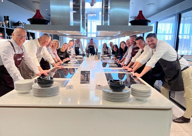 CBRE’s Queensland Executive Committee at the cook-off in the Lumiere Culinary Studio at the Mercedes-Benz building in Newstead.