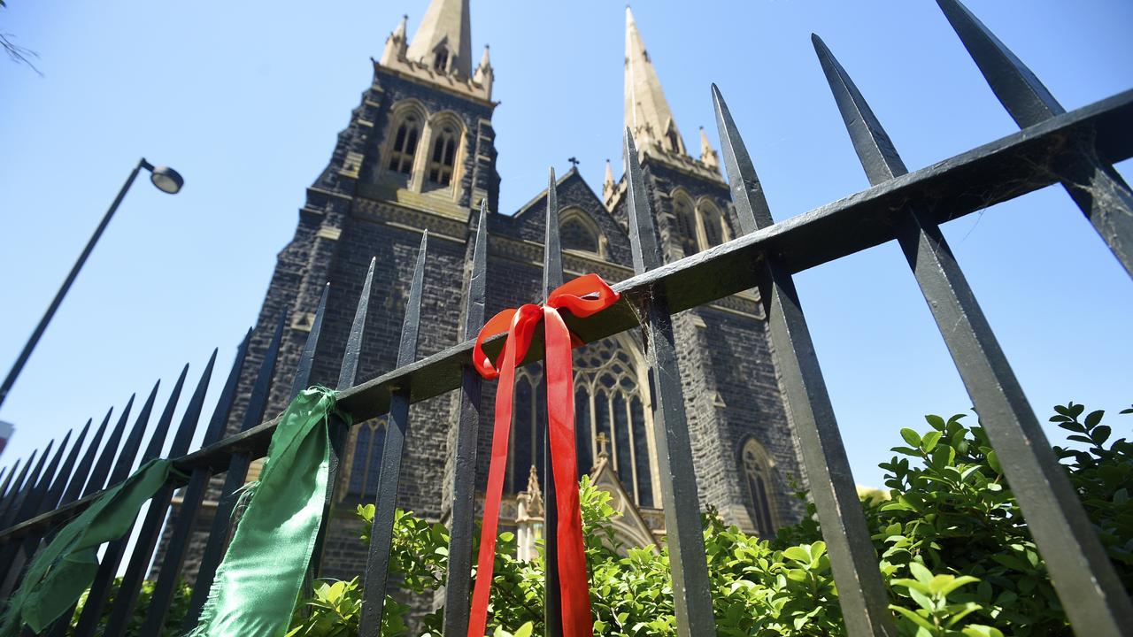 Ribbons in support of child sexual abuse tied on the fence at St Patrick's Cathedral in East Melbourne. Picture: NCA NewsWire / Andrew Henshaw