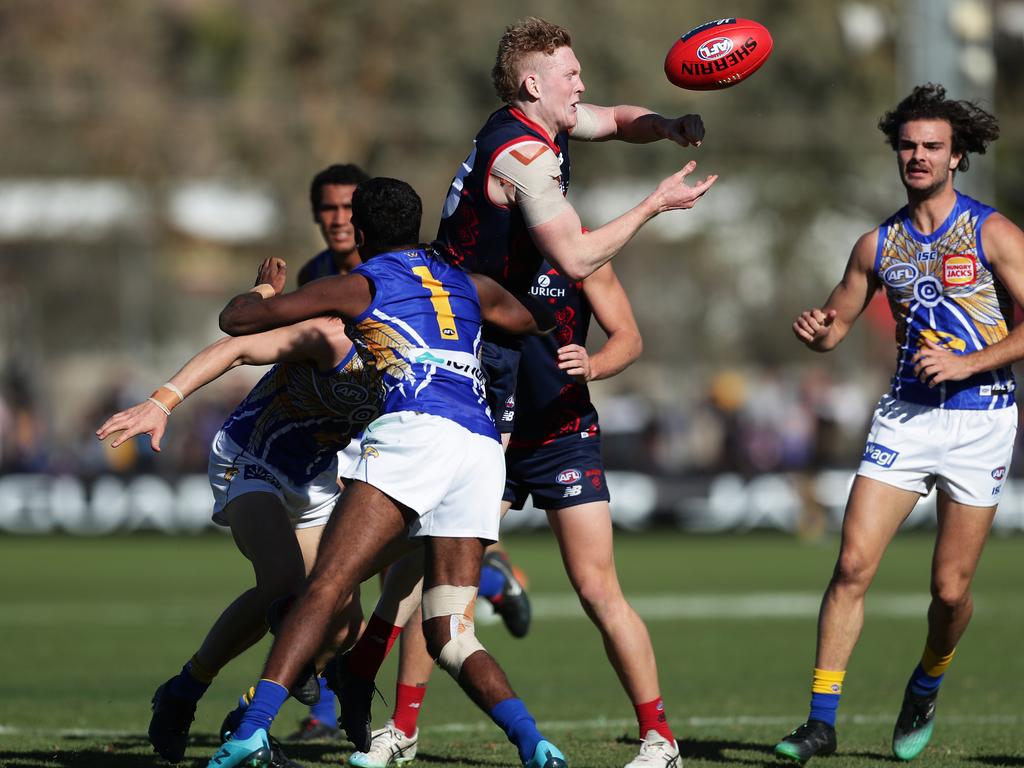 Clayton Oliver of the Demons wins another clearance on his way to a strong SuperCoach AFL score in Round 19