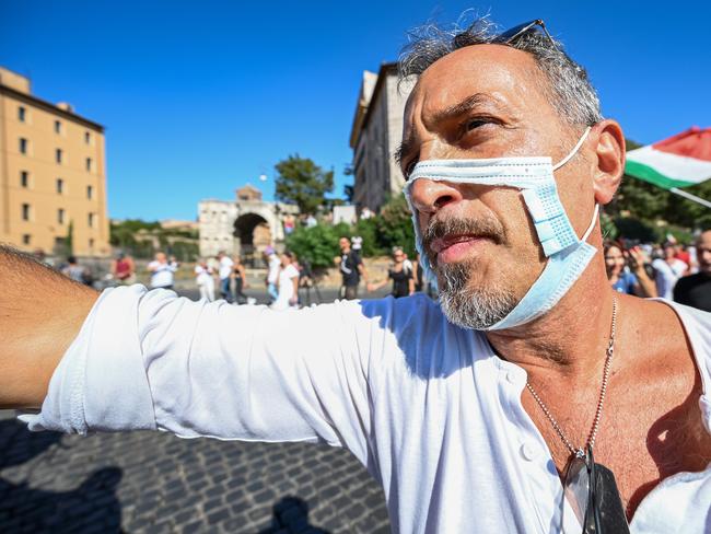 A man wearing a cut out face mask takes part in a "No Mask" protest in Rome. Picture: AFP