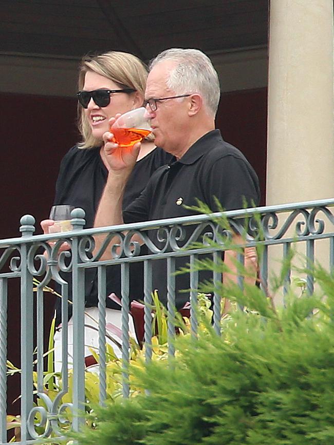 Malcolm Turnbull enjoys a drink at his work Christmas party. Picture: Sam Ruttyn