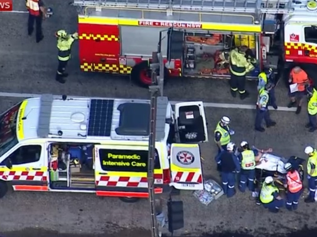 Emergency crews work to free a trapped motorist after a serious crash between a truck and a car shut down the Spit Bridge at Mosman. Picture: Sky News