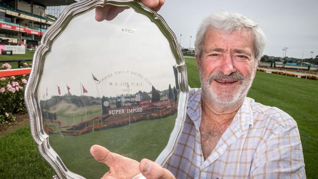 Chris Biggins with the 1992 Cox Plate won by Super impose. Chris and owners are donating the trophy to be auctioned off to raise money for bushfire victims. Picture: Jake Nowakowski