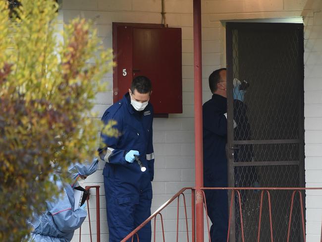 Police forensic and homicide squad officers enter the home. Picture: Nicole Garmston