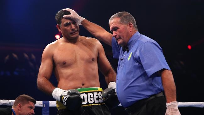 The referee calls the end of the fight between Justin Hodges and Troy McMahon. Picture: Getty