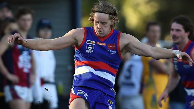 Jaidyn Owen gets a kick away for Gisborne. Picture: Andy Brownbill