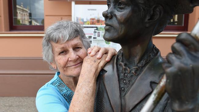 Proud Mary's founder Anne Miller with the Mary Poppins statue on the corner of Richmond and Kent Sts in Maryborough.