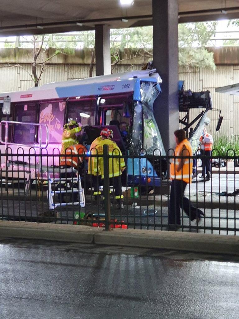 Two passengers and a bus driver are trapped in a bus after it crashed into a pylon in Sydney’s west.