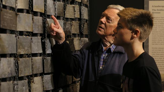 Barry Smith with his grandson Edward Smith, 15, at the TMAG exhibition. Picture: LUKE BOWDEN