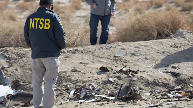 Crash site ... NTSB Acting Chairman Christopher Hart surveying one section of the SpaceShipTwo accident site near Cantil, California. Picture: AFP / National Transportation Safety Board.