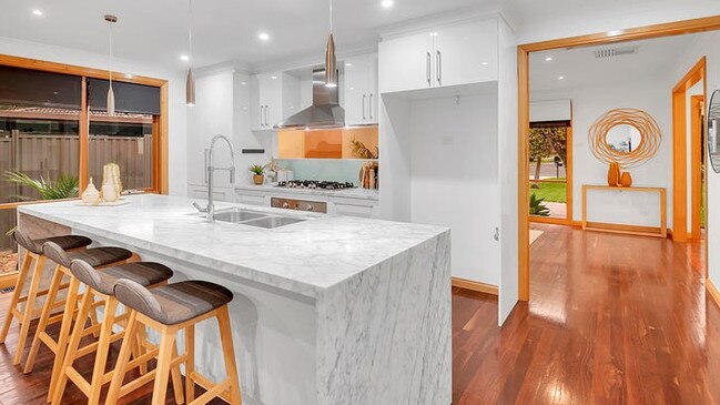 In the kitchen where there’s a marble-bench island breakfast bar, walk-in pantry, Ilve 900mm cooking appliances and Miele dishwasher.