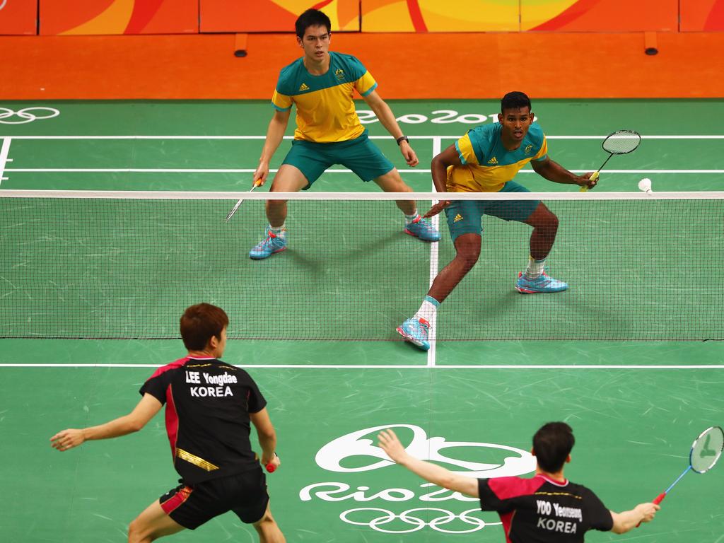 Sawan Serasinghe and Matthew Chau of Australia compete against Nan Zhang and Lee Yong-dae and Yoo Yeon Seong of South Korea in the badminton men’s doubles.