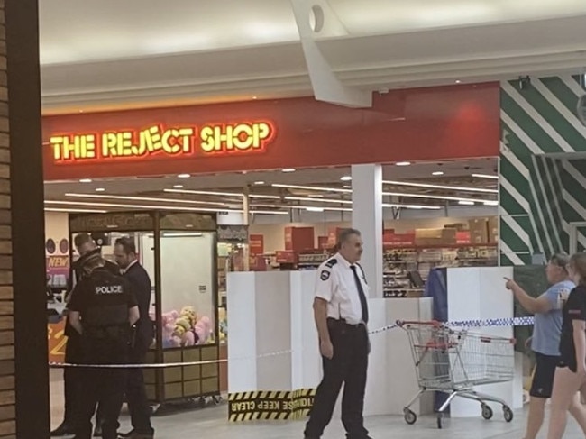 Police at Munno Para Shopping Centre, where a man has been arrested after another man was stabbed. Picture: 7NEWS