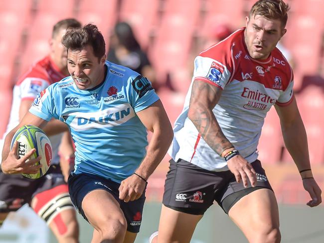 The NSW Waratah's Nick Phipps (C) on his way to scoring a try during the Super XV Rugby Union match between Emirates Lions and NSW Waratahs at Emirates Airline Park, in Johannesburg. Picture: Christiaan Kotze/AFP