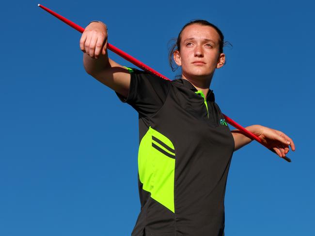 11 year old Emma Matthias poses for photographs with her javelin in Glenbrook. Glenbrook, Thursday, August 16th 2018. Emma Matthias has some outstanding results in athletics, and has been nominated for a Local Sports Star award. (AAP Image / Angelo Velardo)