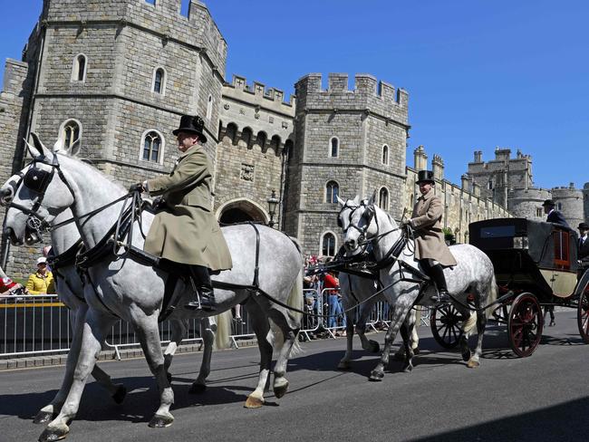 The Ascot Landau carriage pulled by Windsor Grey horses, is taken past the Henry VIII gate during a rehearsal for the wedding procession outside Windsor Castle. Picture: AFP