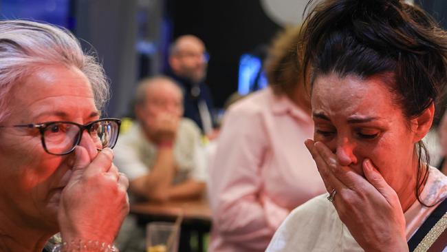 SYDNEY, AUSTRALIA - OCTOBER 14: A Yes supporter reacts at the Inner West for 'Yes2023' official referendum function at Wests Ashfield Leagues Club on October 14, 2023 in Sydney, Australia. A referendum for Australians to decide on an indigenous voice to parliament was held on October 14, 2023 and compelled all Australians to vote by law. Early voting began on Oct. 2, and activity has been intensifying in both the YES and NO camps, with multiple polls showing the YES campaign headed for defeat nationally. Australia requires a "double majority" of both the states and voters across the country to trigger constitutional changes, with most referendums in the past having failed. (Photo by Jenny Evans/Getty Images)