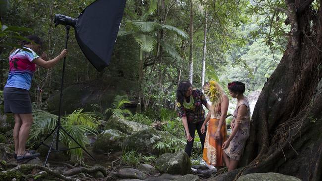 Fashion Designer Grace Lillian Lee assisting at a fashion shoot featuring models Saisha Schonenberger and Samaria Denman on the banks of the Mossman River. Holding the studio light is Sheryl Burchill. .Picture: Russell Shakespeare