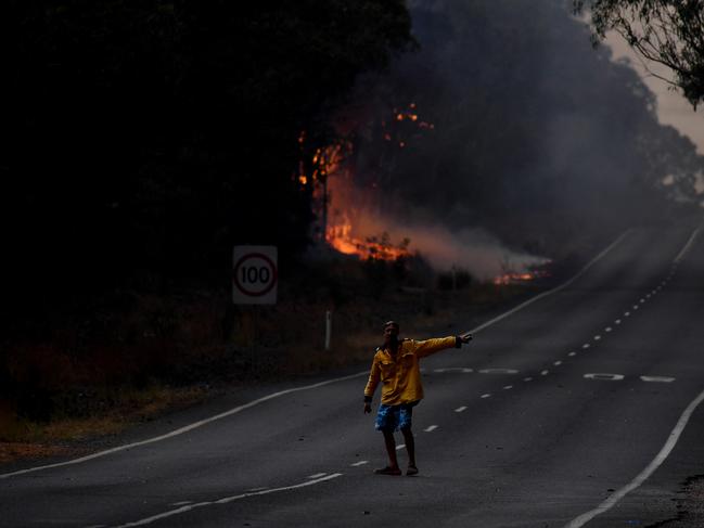 Rural Fire Service (RFS) firefighters prepare for property protection near the town of Sussex Inlet on December 31, 2019 in Sydney, Australia. There are a number of dangerous bushfires burning at emergency level across NSW as weather conditions deteriorate with temperatures expected to rise ahead of gusty southerly change. Princes Highway on the NSW South Coast has been closed with motorists told to avoid all non essential travel. Volunteer firefighter Sam McPaul was killed when his truck rolled over in a freak wind event near Jingellic near the NSW-Victorian border on Monday evening. Picture: Sam Mooy/Getty