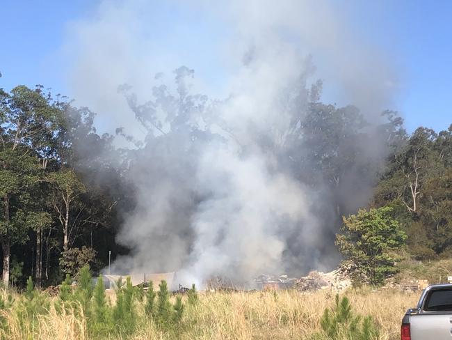 A large shed has gone up in flames on Steve Irwin Way in Glenview near the BP Service Station. Picture: Tyler Sluga