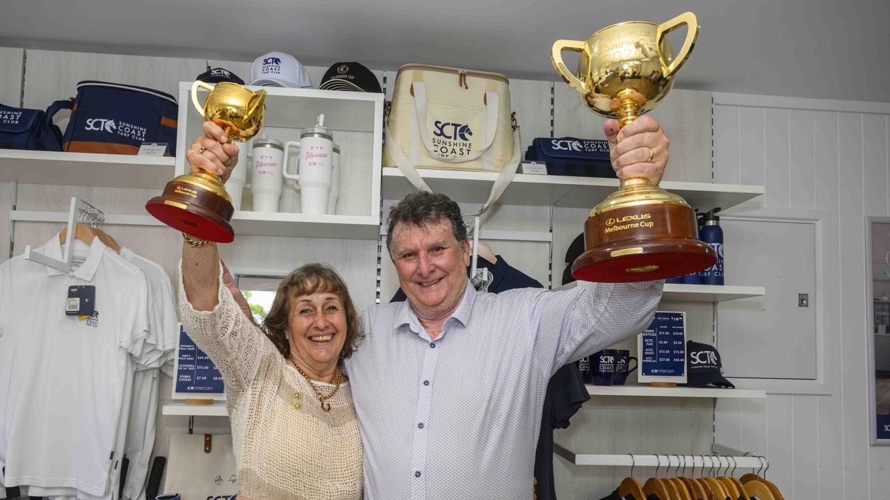 Sheila Laxon and John Symons with the Melbourne Cup trophy. Picture: Michael McInally