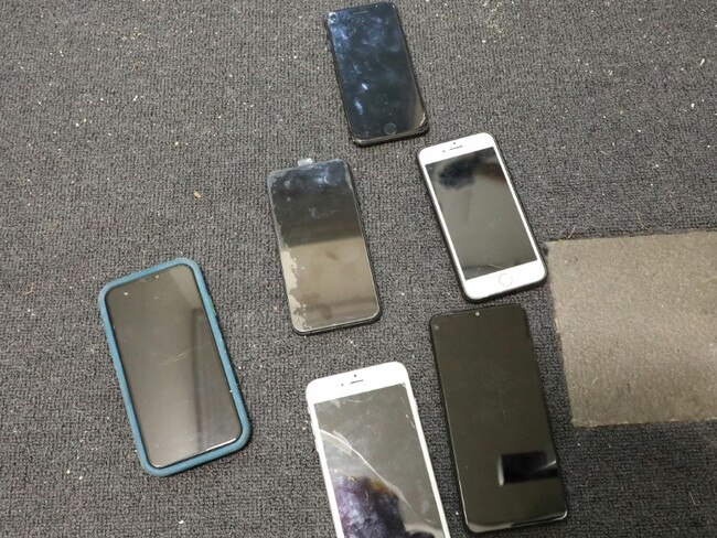 Several phones were seized and numbers shut down by police officers. Picture: NSW Police