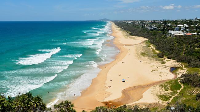 View over Sunshine Beach south of Noosa, QLD, with people.